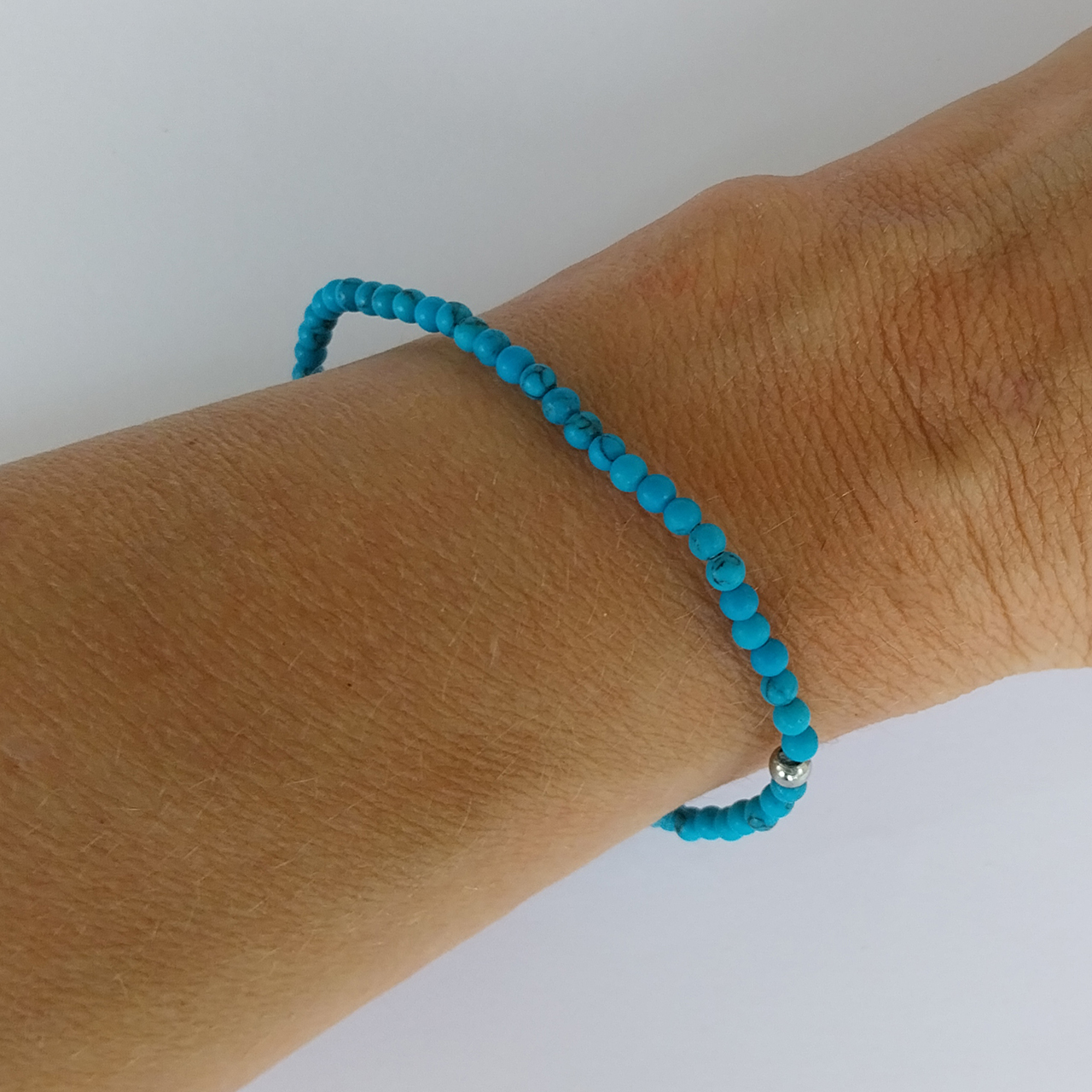 Wrist showing Aqua Blue Howlite 4mm bracelet Wrist showing Aqua Blue Howlite 4mm bracelet