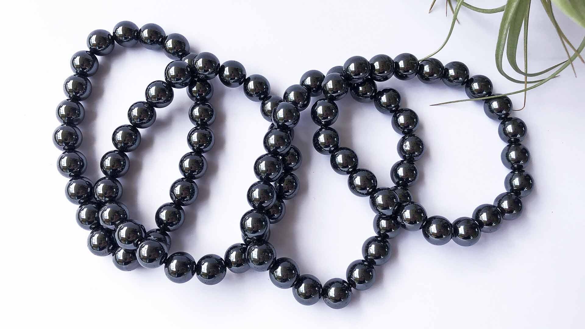 Magnetic Therapy Magnetite Bracelets Magnetite 10mm bead bracelets on white background