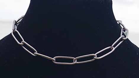 Paperclip chain on black bust