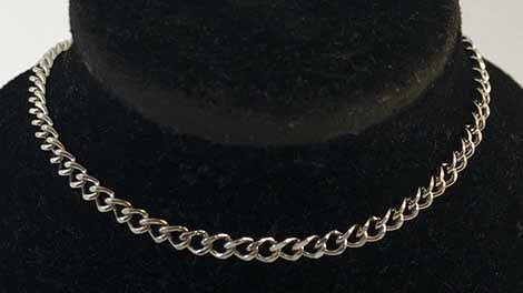 Curb chain on black bust