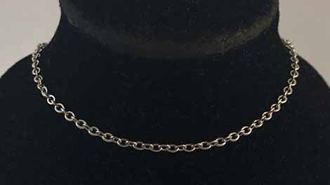 Cable chain on black bust