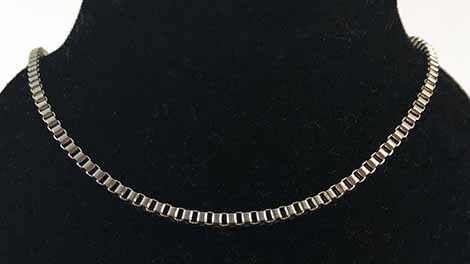 Box Chain on black bust