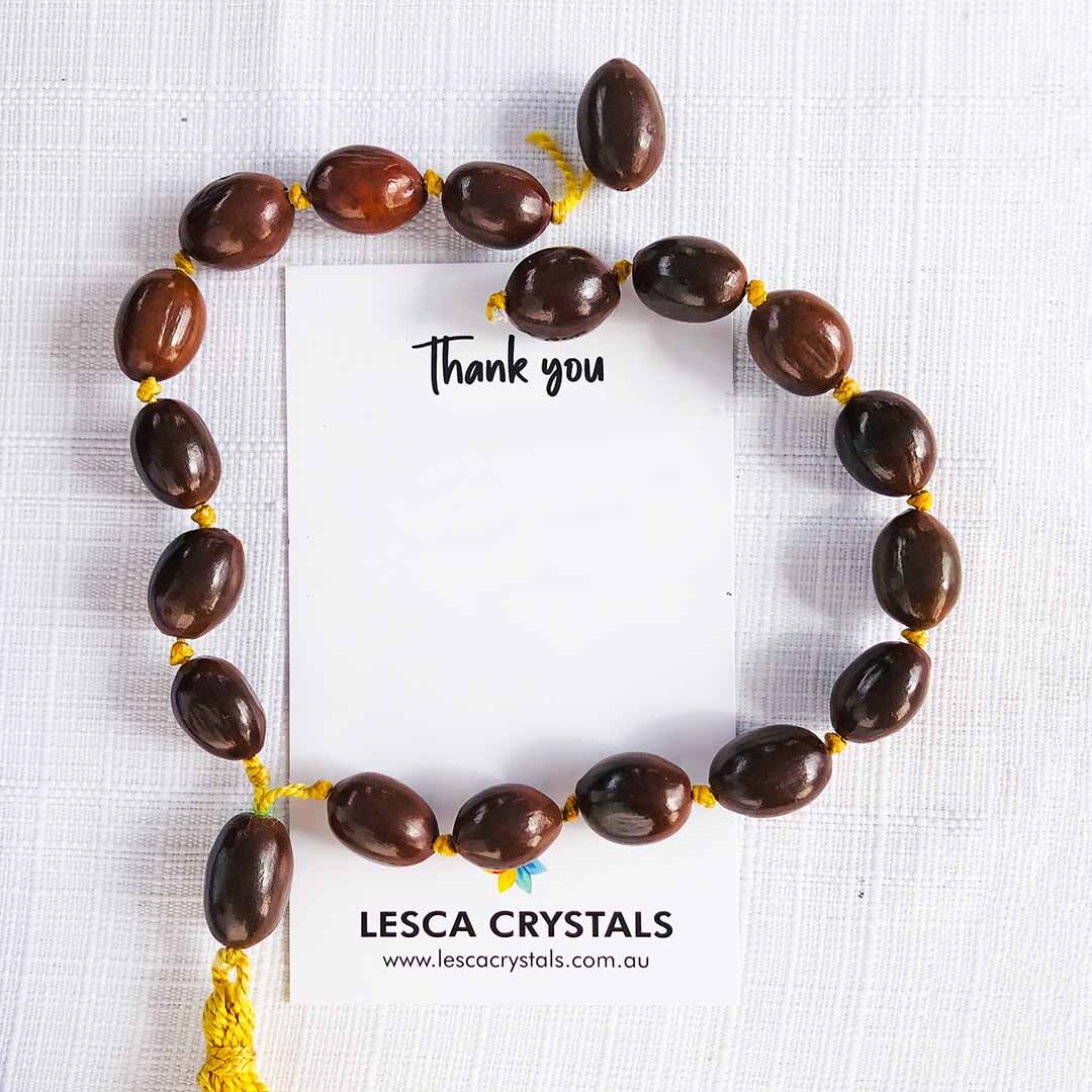 Broken Cord on Bead Mala on white background