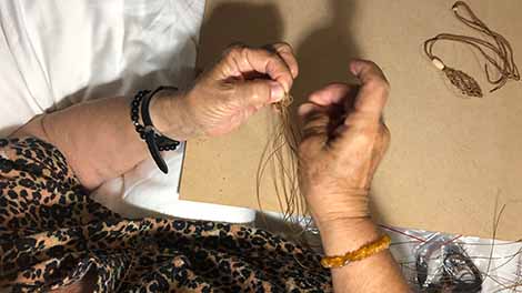 Lesley making a macrame pouch