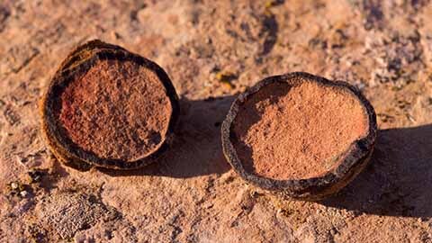 Cross-section of moqui marbles resting on sandstone
