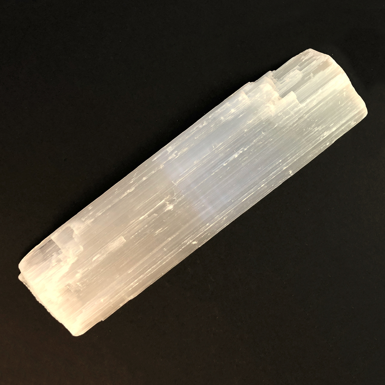 Selenite Rod on black background
